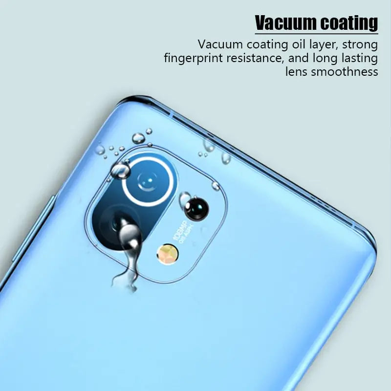 the back of a blue smartphone with a water droplet on it