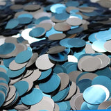 there are many blue and silver confetti confetti on a table