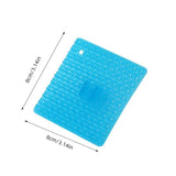 a blue plastic square shaped object with a white background