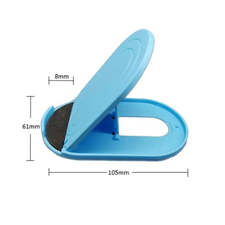 a blue plastic toilet seat with a black sponge