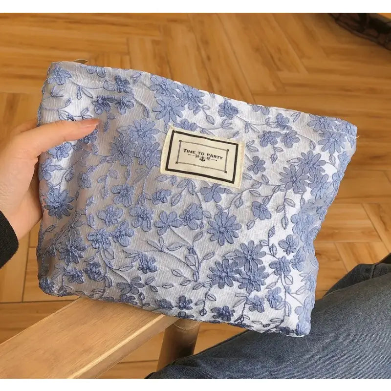 a blue and white floral print bag