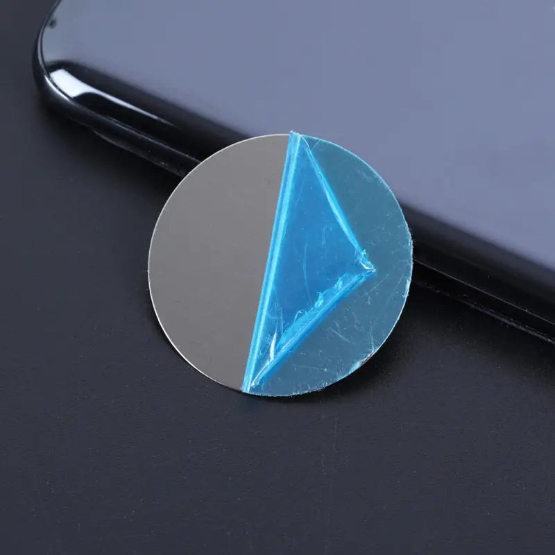 a blue triangle shaped glass magnet magnet