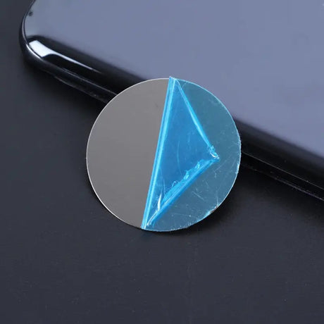 a blue and white triangle shaped glass magnet