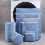 a set of blue toilet bags with gold foil embroidery