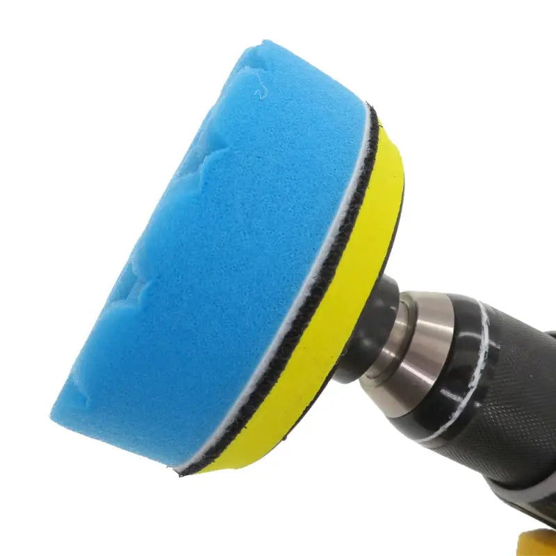 a blue and yellow polisher with a white background
