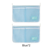 two blue bags with a white label on them and a blue bag with a white label