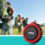 a red speaker with a man in the background