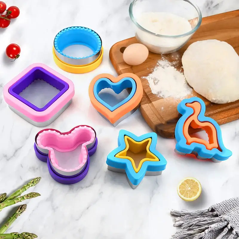 a cutting board with various cookie cutters and ingredients