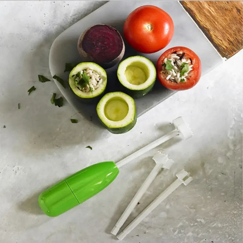 a cutting board with a knife, tomatoes, and avoca