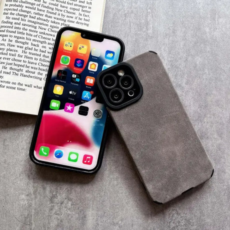 A book and an iphone case sitting on a table