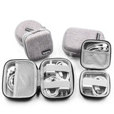 a set of four cases with earphones in them