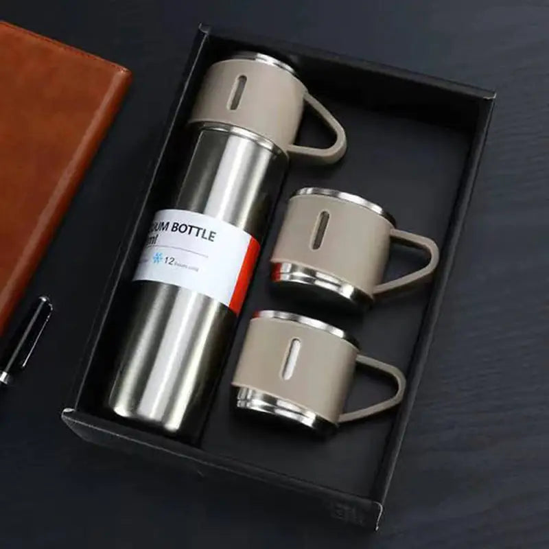 a stainless steel flask with a leather case