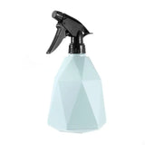 a spray bottle with a black trigger on a white background