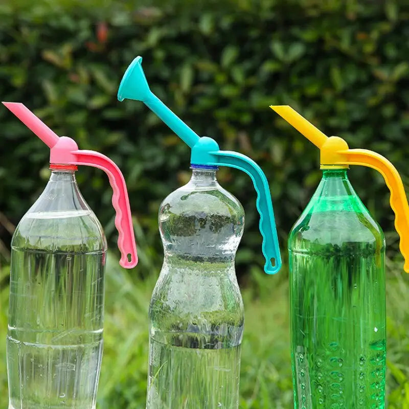 three plastic bottles with colorful straws on them