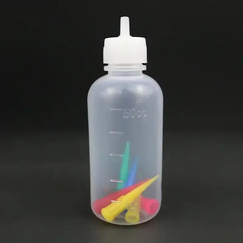 a bottle with a small plastic object inside