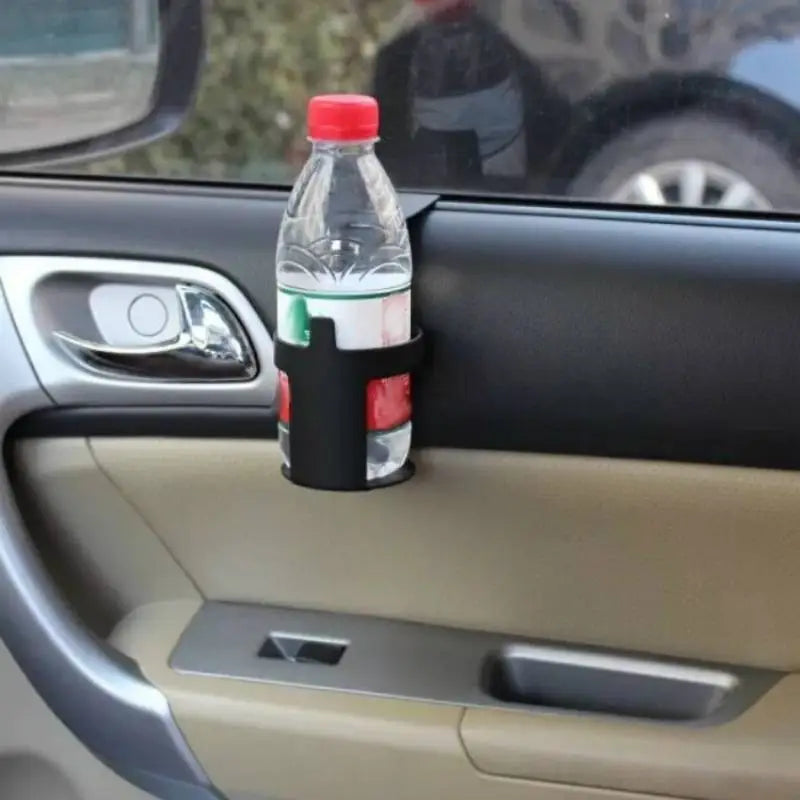 a bottle of water is sitting on the dashboard of a car