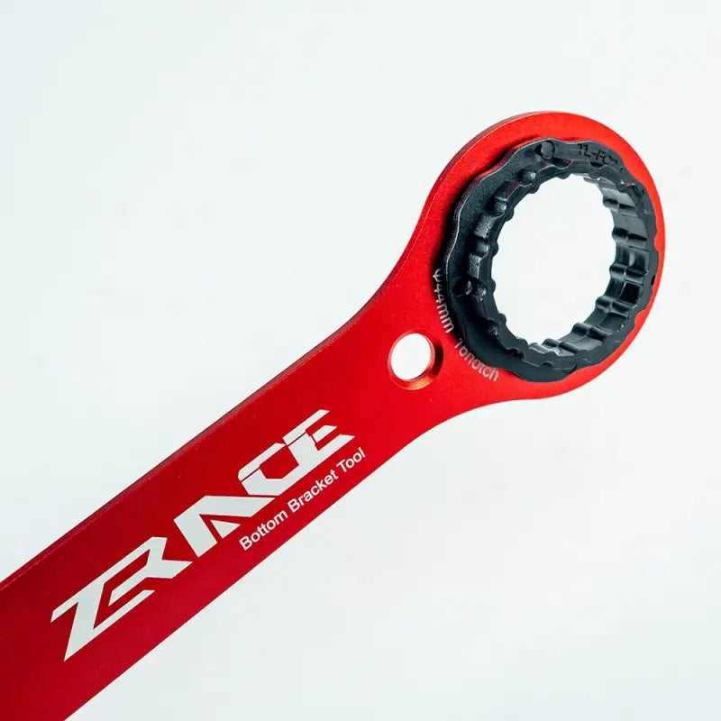 a red bike handle with a black handle