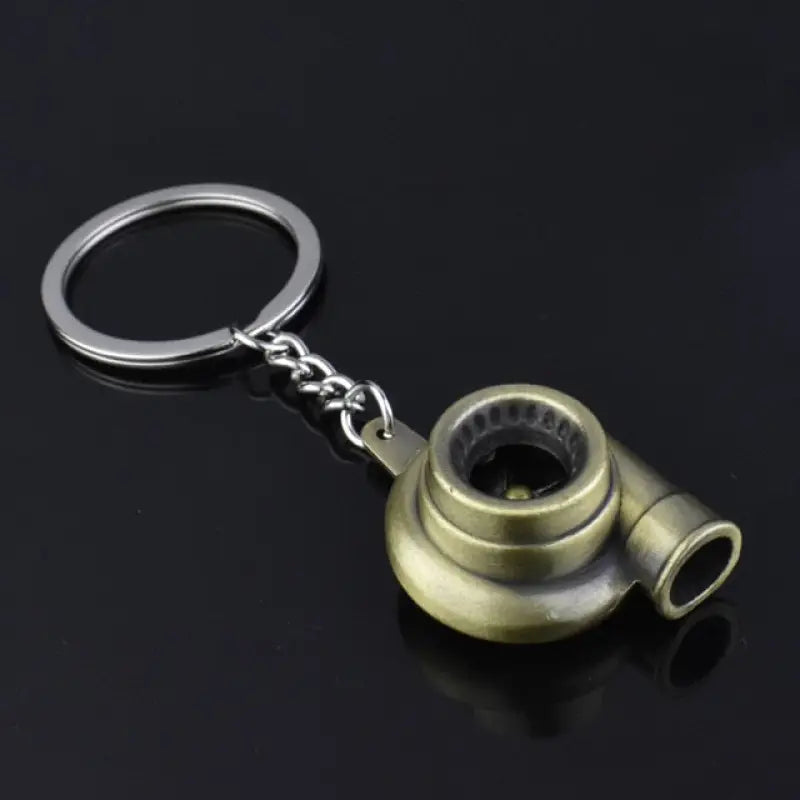 a brass keychai with a metal bell