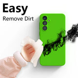 Bright green smartphone case with three camera lenses and black smudges being wiped off.