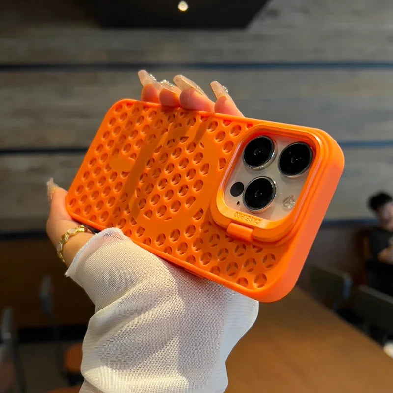 Bright orange smartphone case with a waffle-like textured pattern and camera cutouts.