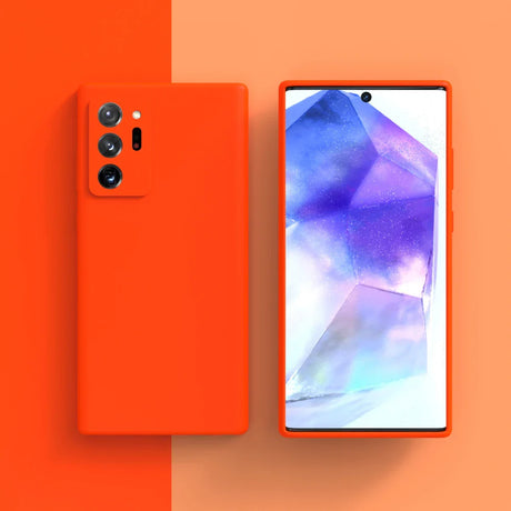 Bright orange smartphone with a triple camera setup and colorful display showing abstract geometric shapes.