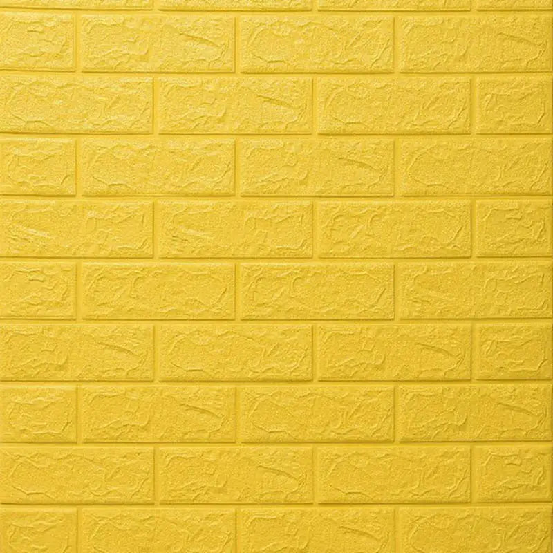 a yellow brick wall with a white brick