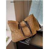 a brown and black bag sitting on top of a table