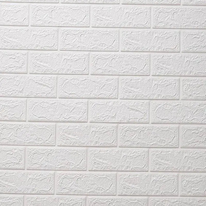 a close up of a white brick wall with a fire hydrant