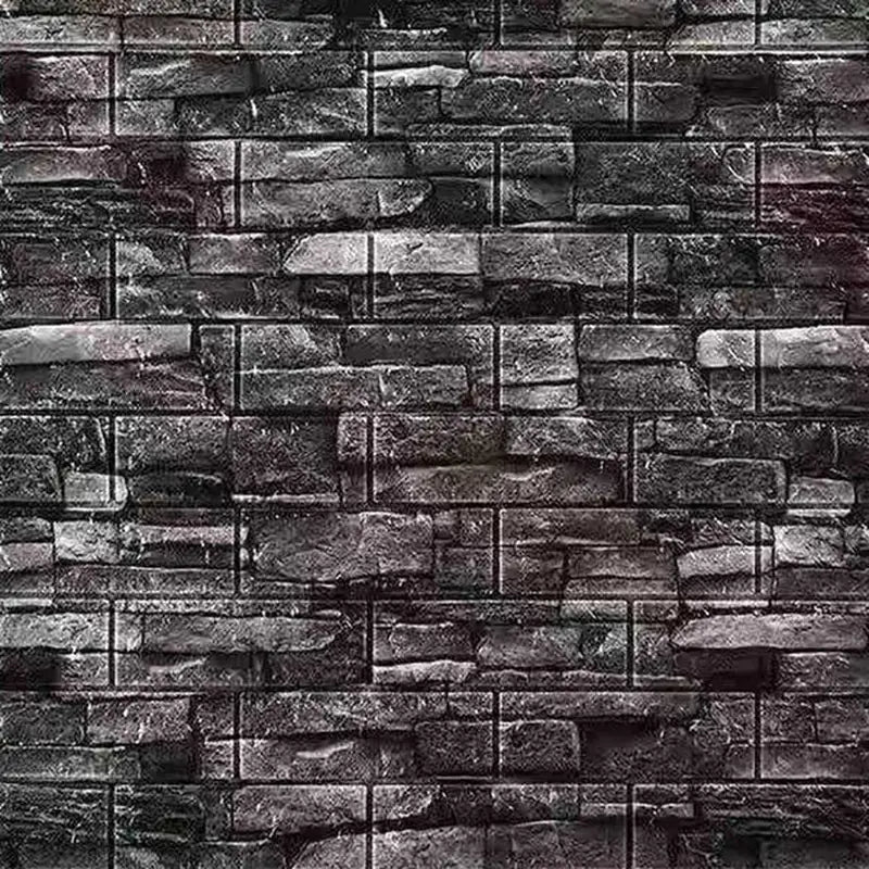a brick wall with a dark grey stone pattern