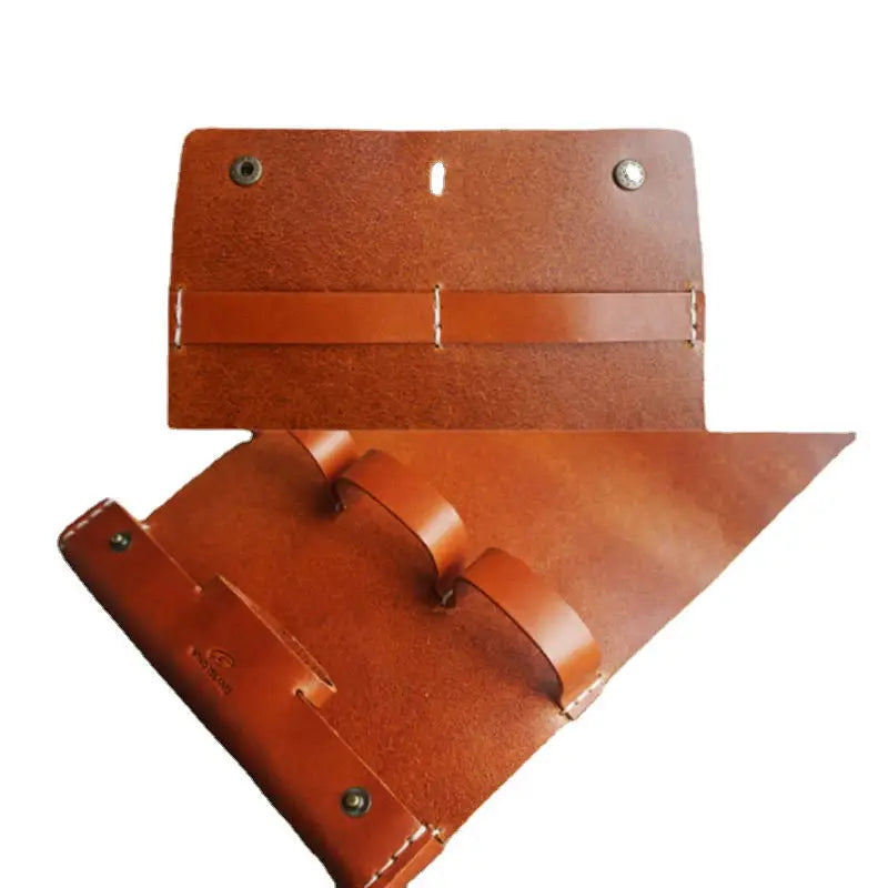 a pair of leather luggage tags