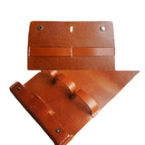 a pair of leather luggage tags