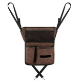 the back of a brown leather shoulder bag with a black strap