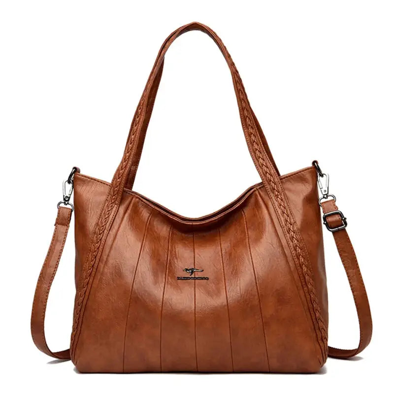 a brown leather handbag with braid detailing