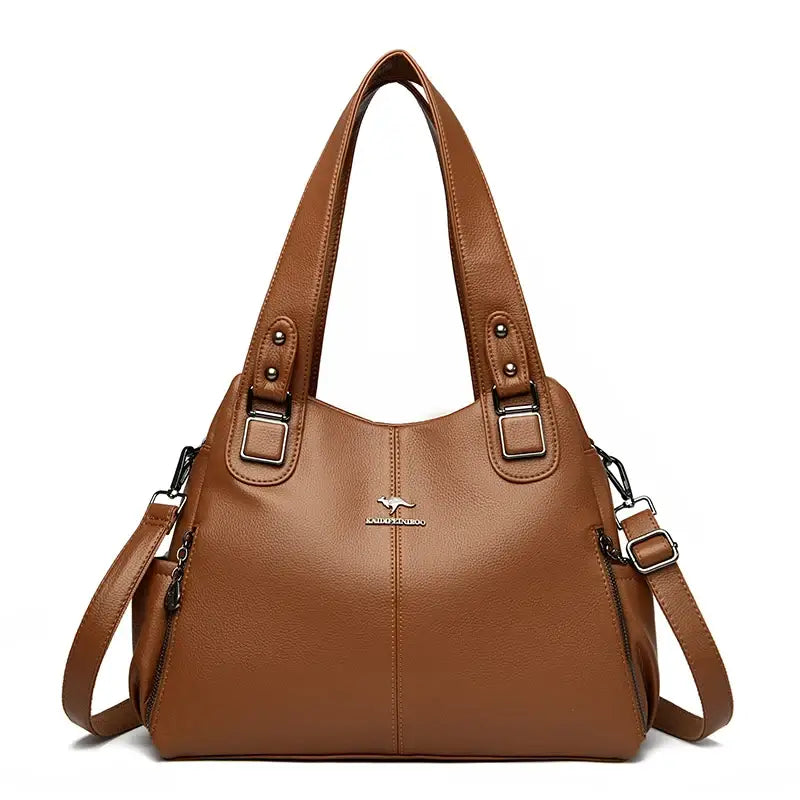 a brown leather handbag with a zipper closure