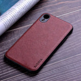 the back of a brown leather iphone case