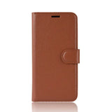 the back of a brown leather iphone case