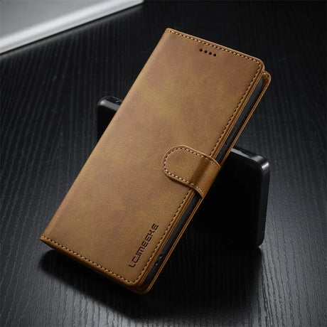 Brown leather-look phone wallet case with a magnetic clasp.