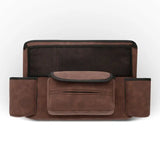 the brown leather travel bag with a black mesh pocket