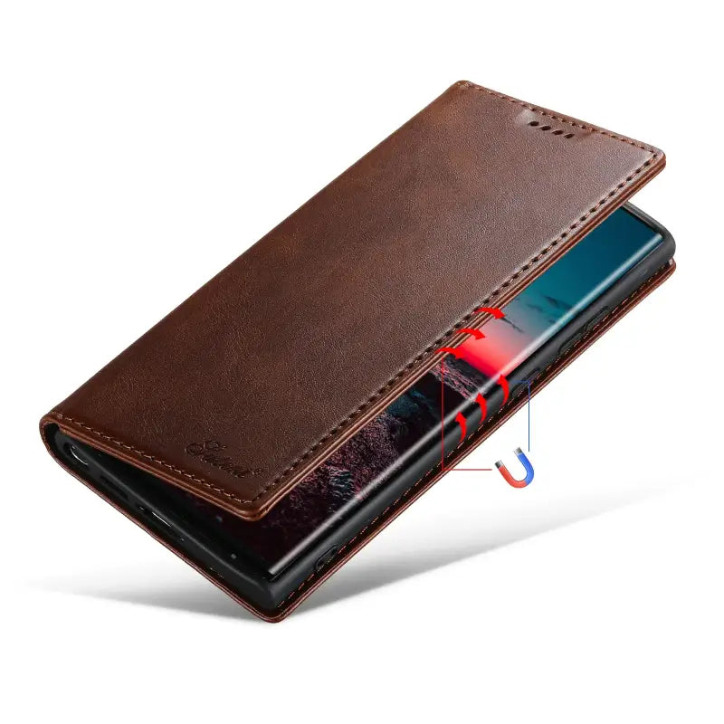 the back of a brown leather wallet case with a red light coming out