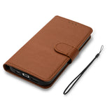 The brown leather wallet case is shown with a black phone