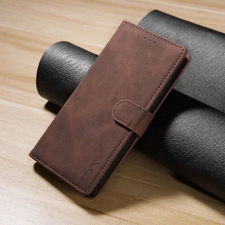 Brown leather wallet or phone case with a clasp closure.