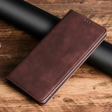 Brown leather wallet or phone case with a folded design.