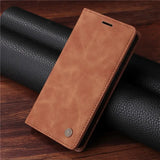 Brown leather wallet-style phone case with a folding cover.