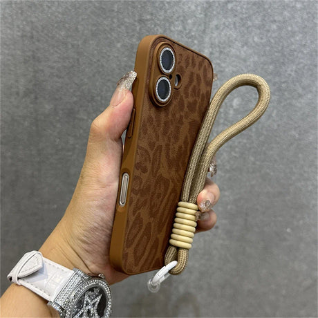 Brown leopard-print phone case with wrist strap.