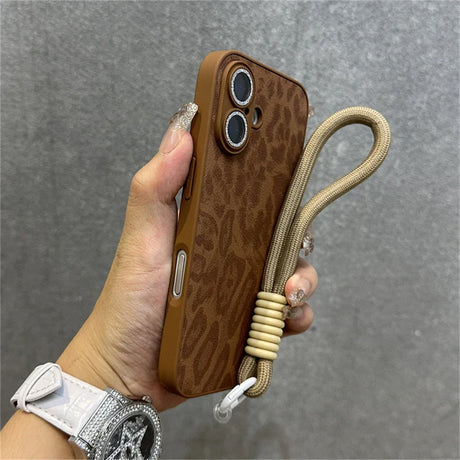 Brown leopard-print phone case with wrist strap.
