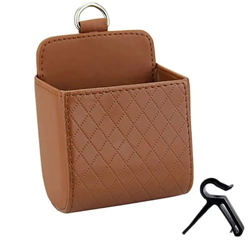 a brown leather case with a key holder