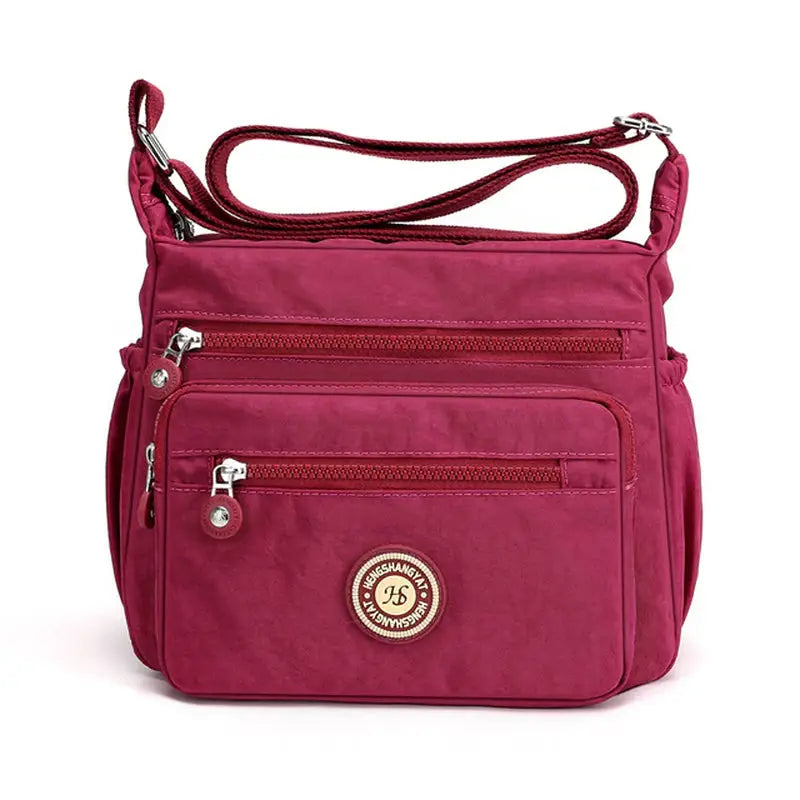 the small cross body bag in pink