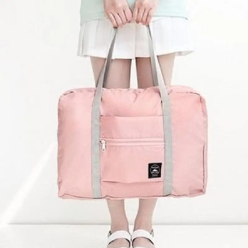 a woman holding a pink bag