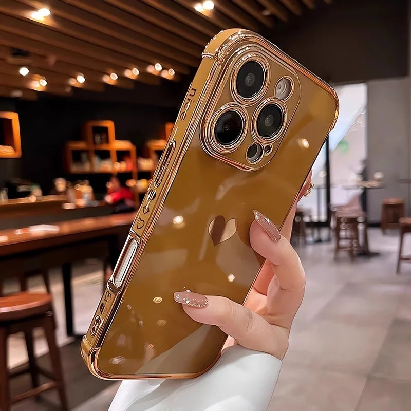 Brown phone case with a heart cutout and gold trim