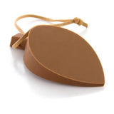a brown guitar pick with a string